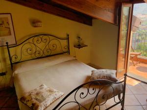 Postel nebo postele na pokoji v ubytování Agriturismo L'Olivara