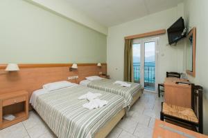 Postel nebo postele na pokoji v ubytování Plaz Hotel