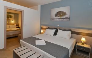 Postel nebo postele na pokoji v ubytování Iraklis Hotel