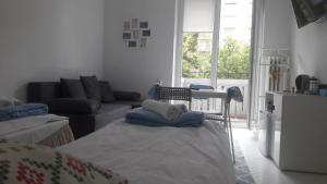 Posteľ alebo postele v izbe v ubytovaní Ogrodowa Apartments