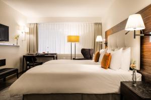 Postel nebo postele na pokoji v ubytování Hotel Astoria + 13 fotografií