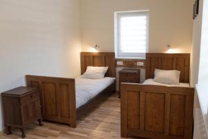 Ένα ή περισσότερα κρεβάτια σε δωμάτιο στο Go2Krynica - Halna