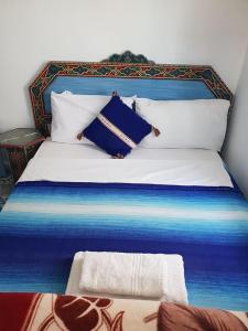 Ένα ή περισσότερα κρεβάτια σε δωμάτιο στο Hotel Ouarzazate