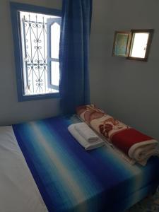 Ένα ή περισσότερα κρεβάτια σε δωμάτιο στο Hotel Ouarzazate