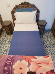 Ένα ή περισσότερα κρεβάτια σε δωμάτιο στο Hotel Ouarzazate