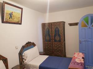 Ένα ή περισσότερα κρεβάτια σε δωμάτιο στο Hotel Ouarzazate