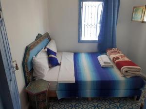 Ένα ή περισσότερα κρεβάτια σε δωμάτιο στο Hotel Ouarzazate