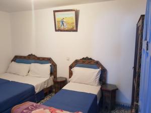 Ένα ή περισσότερα κρεβάτια σε δωμάτιο στο Hotel Ouarzazate