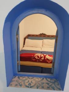 Ένα ή περισσότερα κρεβάτια σε δωμάτιο στο Hotel Ouarzazate