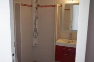 a bathroom with a shower and a sink at Les Stoechades in Hyères