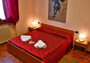 Ένα ή περισσότερα κρεβάτια σε δωμάτιο στο Bed And Breakfast Il Riccio