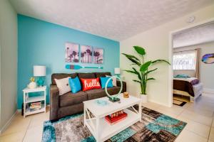 a living room with a couch and a table at Beautiful Old Apartment with Beach Gear in Fort Lauderdale