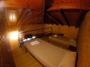 Cama ou camas em um quarto em La Cautiva Iguazú Hotel