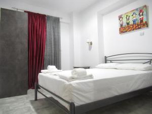 Postel nebo postele na pokoji v ubytování Artistic Rent Rooms & Apartments