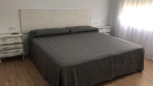 Posteľ alebo postele v izbe v ubytovaní Casa Cesar Martinell 1
