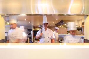 a group of chefs standing in a kitchen at Midas Hotel and Casino in Manila