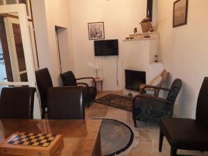 a living room with a chess board on a table at Lefkara View in Pano Lefkara