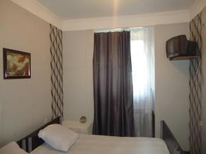 Postel nebo postele na pokoji v ubytování Guest House R&T