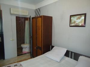 Postel nebo postele na pokoji v ubytování Guest House R&T