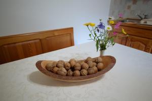 a bowl of potatoes sitting on a kitchen counter at Turistična kmetija Čerček in Solčava