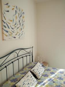 Postel nebo postele na pokoji v ubytování BILOCALE VIA CURZI centralissimo + 12 fotografií