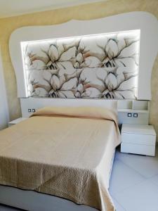 Posteľ alebo postele v izbe v ubytovaní Residence Tre Gemme