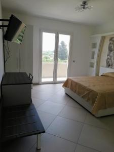 Posteľ alebo postele v izbe v ubytovaní Residence Tre Gemme