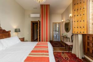 Postel nebo postele na pokoji v ubytování Alquería Calatrava B&B