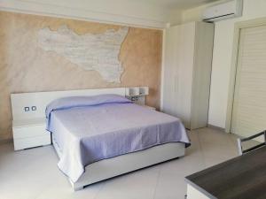 Posteľ alebo postele v izbe v ubytovaní Residence Tre Gemme