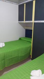A bed or beds in a room at VILLAGGIO STAGNONE