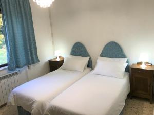 two beds sitting next to each other in a room at PIAN DEL LECCIONE in Manciano