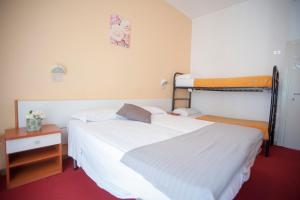 Postel nebo postele na pokoji v ubytování Villa Silvie Rose