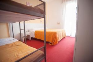 Postel nebo postele na pokoji v ubytování Villa Silvie Rose