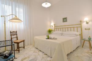 Posteľ alebo postele v izbe v ubytovaní La Kenzia Casa Vacanze