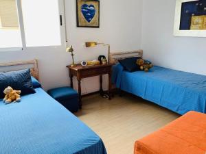Postel nebo postele na pokoji v ubytování Apartamento frente al Mar