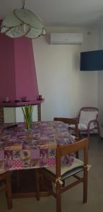 a table with a table cloth on it with a chair at Relax da Sabry in Senigallia