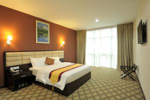 Voodi või voodid majutusasutuse Hallmark Regency Hotel - Johor Bahru toas
