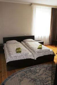 Katil atau katil-katil dalam bilik di Guesthouse Suja