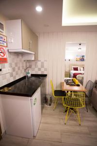 Kuchyň nebo kuchyňský kout v ubytování T-Square Residence