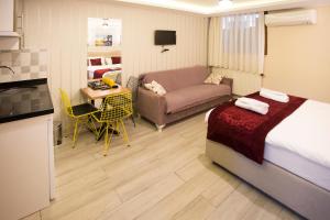Postel nebo postele na pokoji v ubytování T-Square Residence
