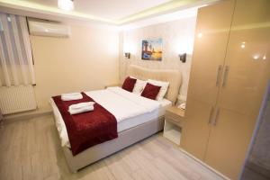 Postel nebo postele na pokoji v ubytování T-Square Residence