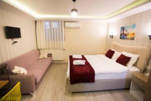 Postel nebo postele na pokoji v ubytování T-Square Residence