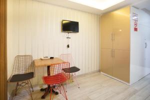 TV a/nebo společenská místnost v ubytování T-Square Residence