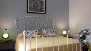 Letto o letti in una camera di Dimora Villa Serena Porto Selvaggio