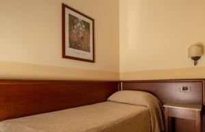 Postel nebo postele na pokoji v ubytování Hotel Gangi