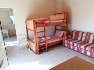 a room with two bunk beds and a couch at NEON Apartment, spacious, fully equipped, high-quality Apt with balcony, Messara Plain, south Crete in Vayioniá