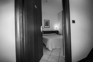 Postel nebo postele na pokoji v ubytování Hotel Gangi