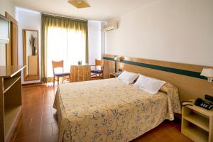 Postel nebo postele na pokoji v ubytování Hotel Bersoca