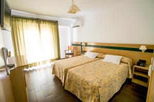 Postel nebo postele na pokoji v ubytování Hotel Bersoca
