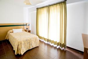 Postel nebo postele na pokoji v ubytování Hotel Bersoca